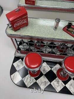 'Vintage 2000 Barbie Coca Cola Soda Shop Fountain Play set Limited Edition 26980' translates to 'Vintage 2000 Barbie Coca Cola Soda Shop Fountain Play set Édition Limitée 26980' in French.